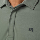 Travis Mathew Heater Series Jersey Polo in Balsam Green, detail view