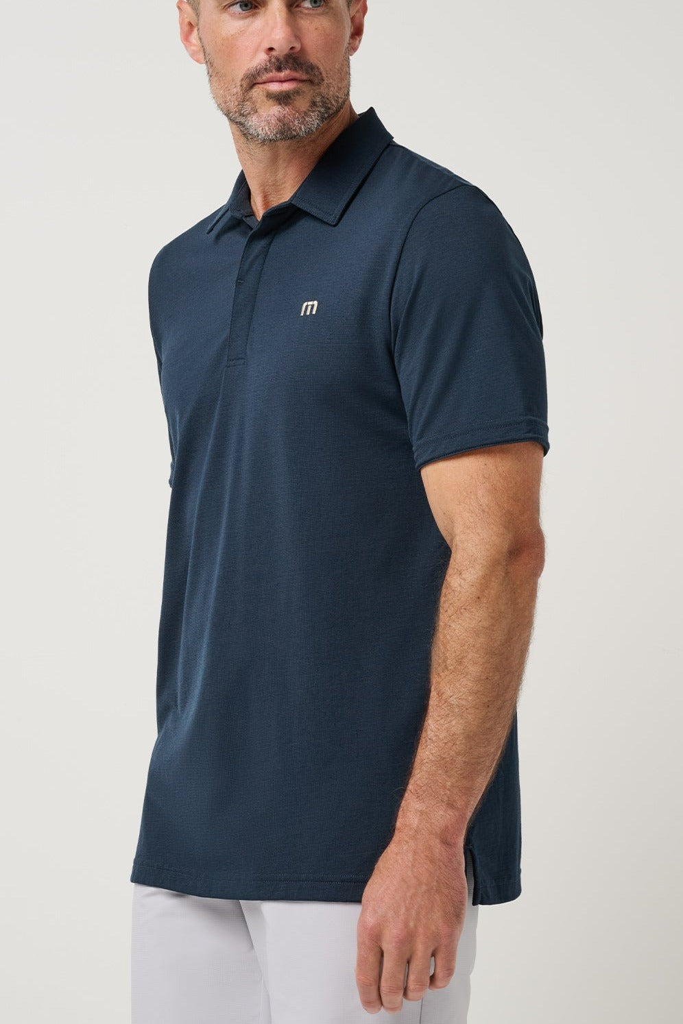 Travis Mathew Heater Series Jersey Polo in Total Eclipse, side view