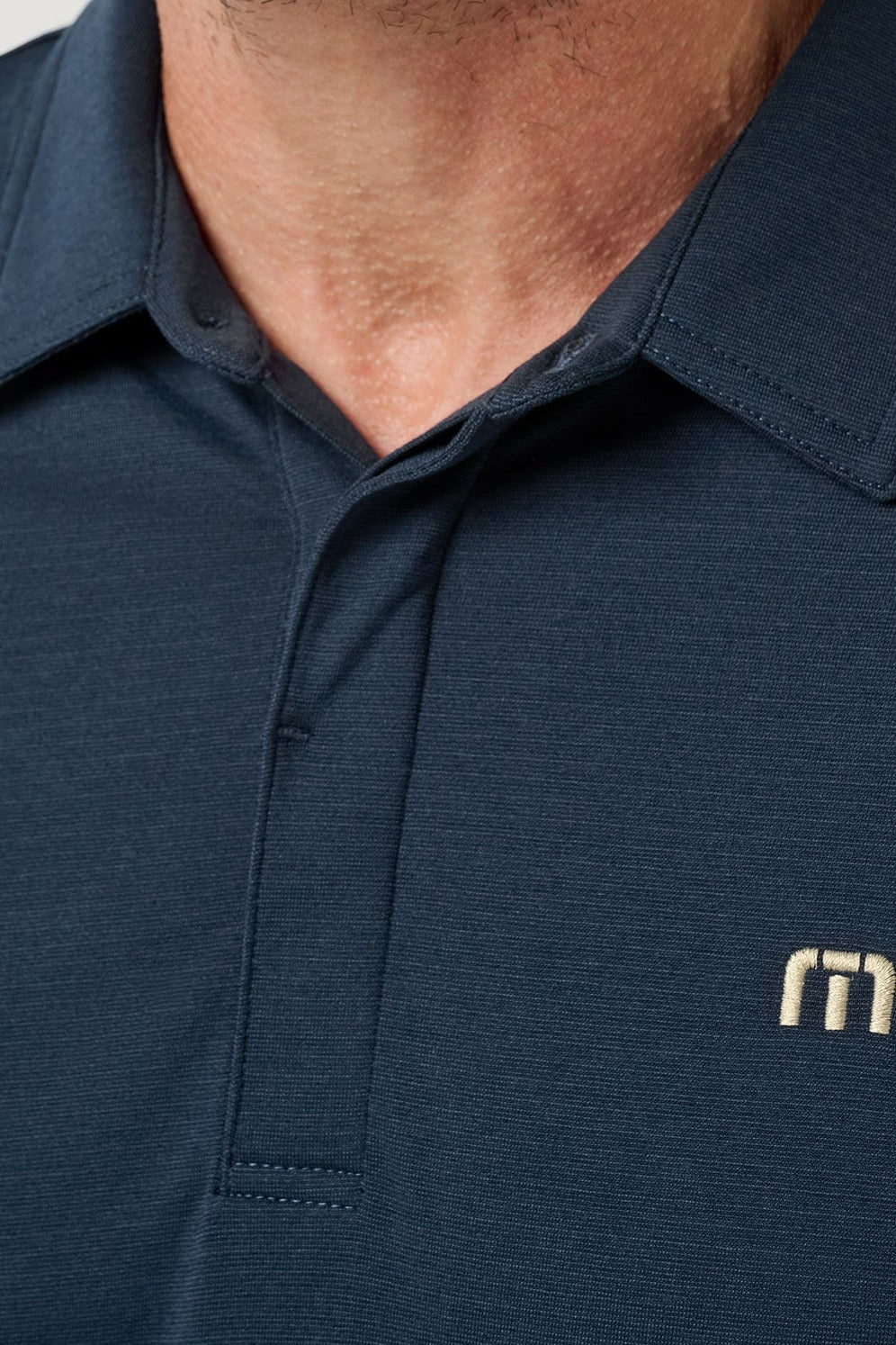 Travis Mathew Heater Series Jersey Polo in Total Eclipse, detail view