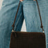 Suede Harper Hobo Shoulder Bag in Black worn on the shoulder