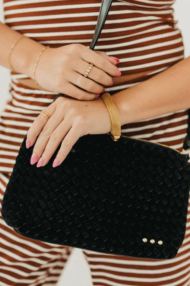 Suede Harper Hobo Shoulder Bag in Black held at the hip