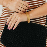 Suede Harper Hobo Shoulder Bag in Black held at the hip
