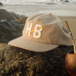 Howler Bros Big HB snapback in Cowhide, worn
