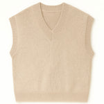 Beige knitted vest on a white background
