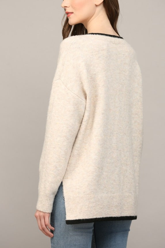 Oatmeal V-neck sweater shoulder and side slit detail