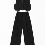 Black sleeveless vest and wide-leg pants set on a white background