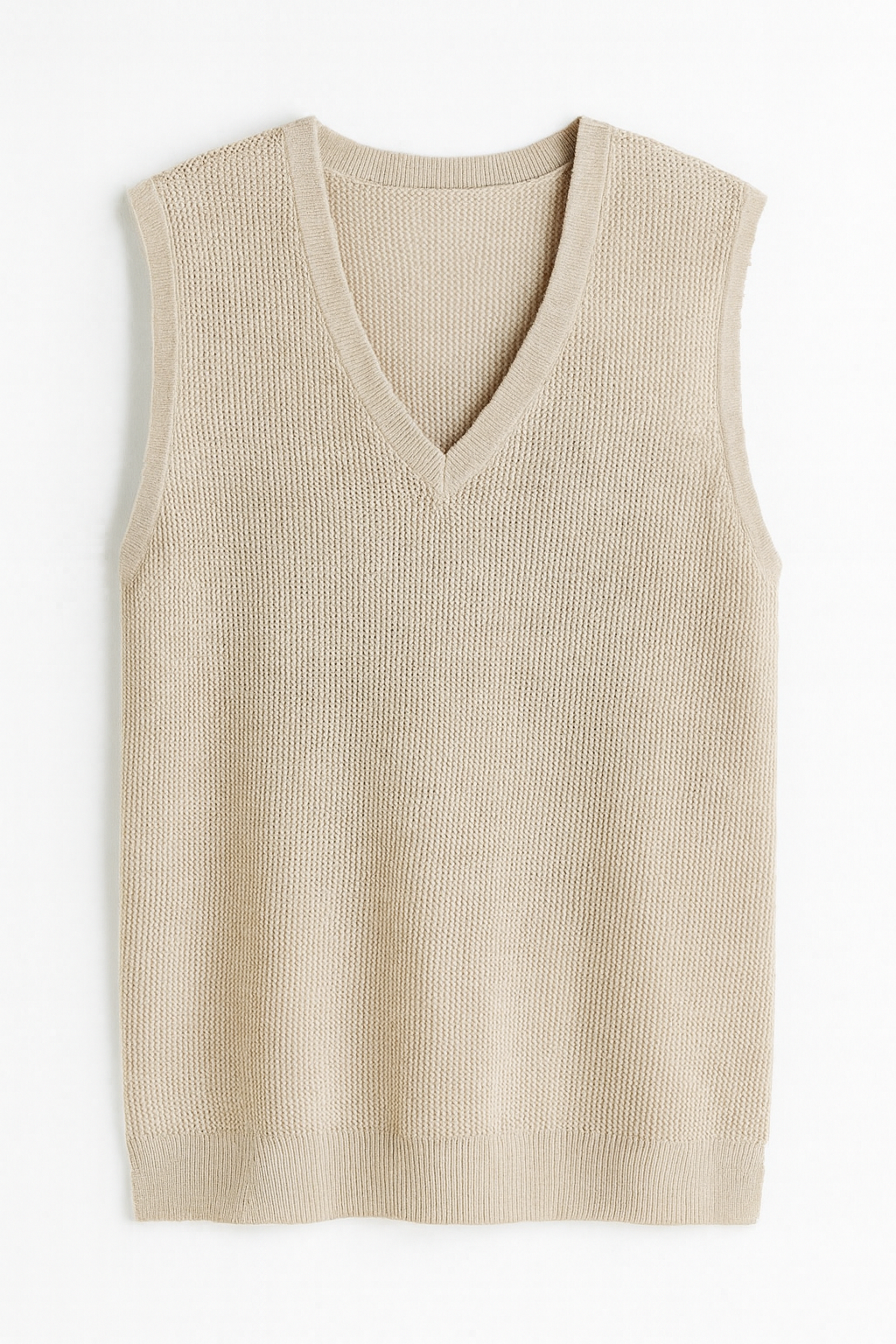 Beige ribbed knit vest on a white background