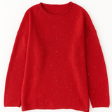 Red sweater with small white speckles on a white background