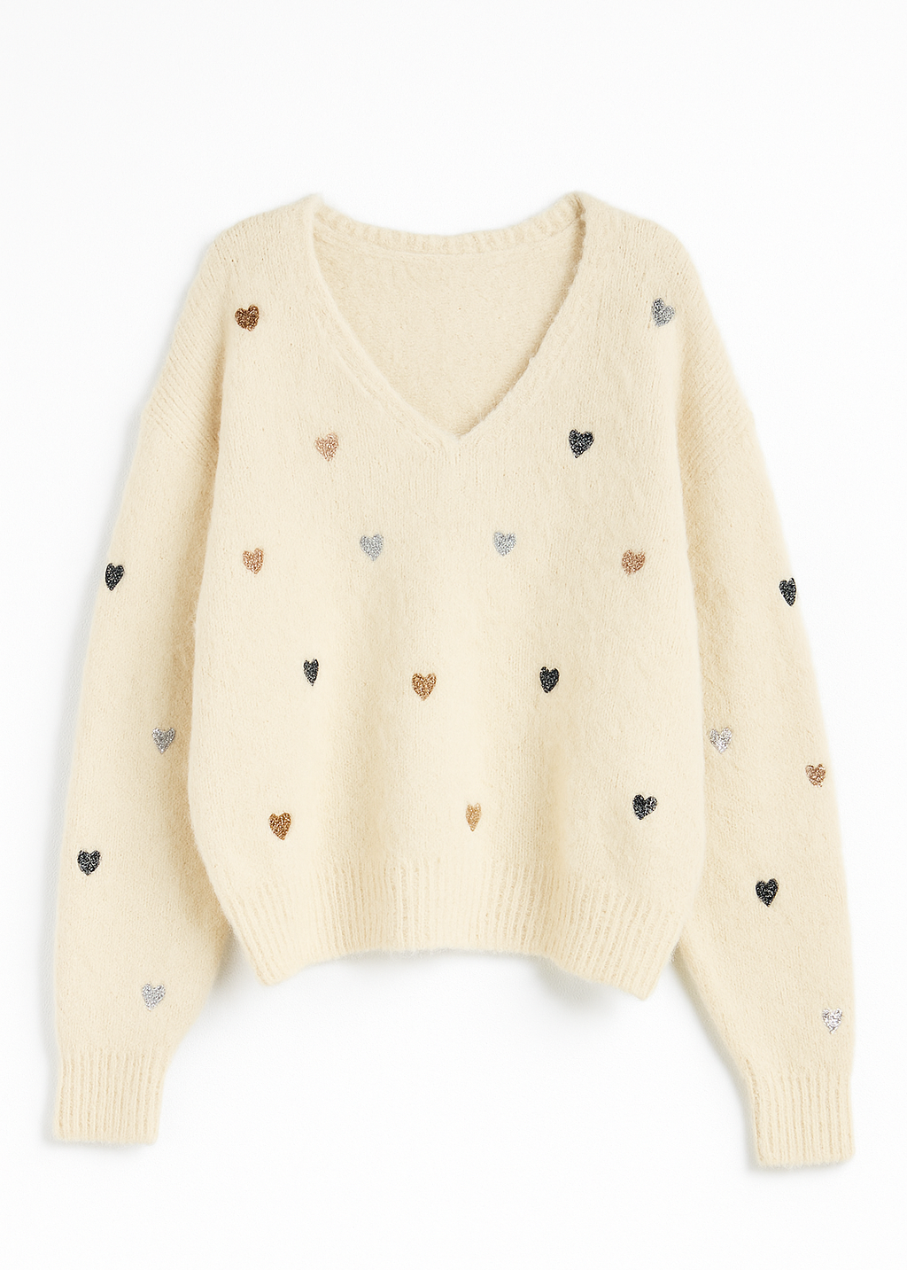 Cream-colored sweater with small heart patterns on a white background