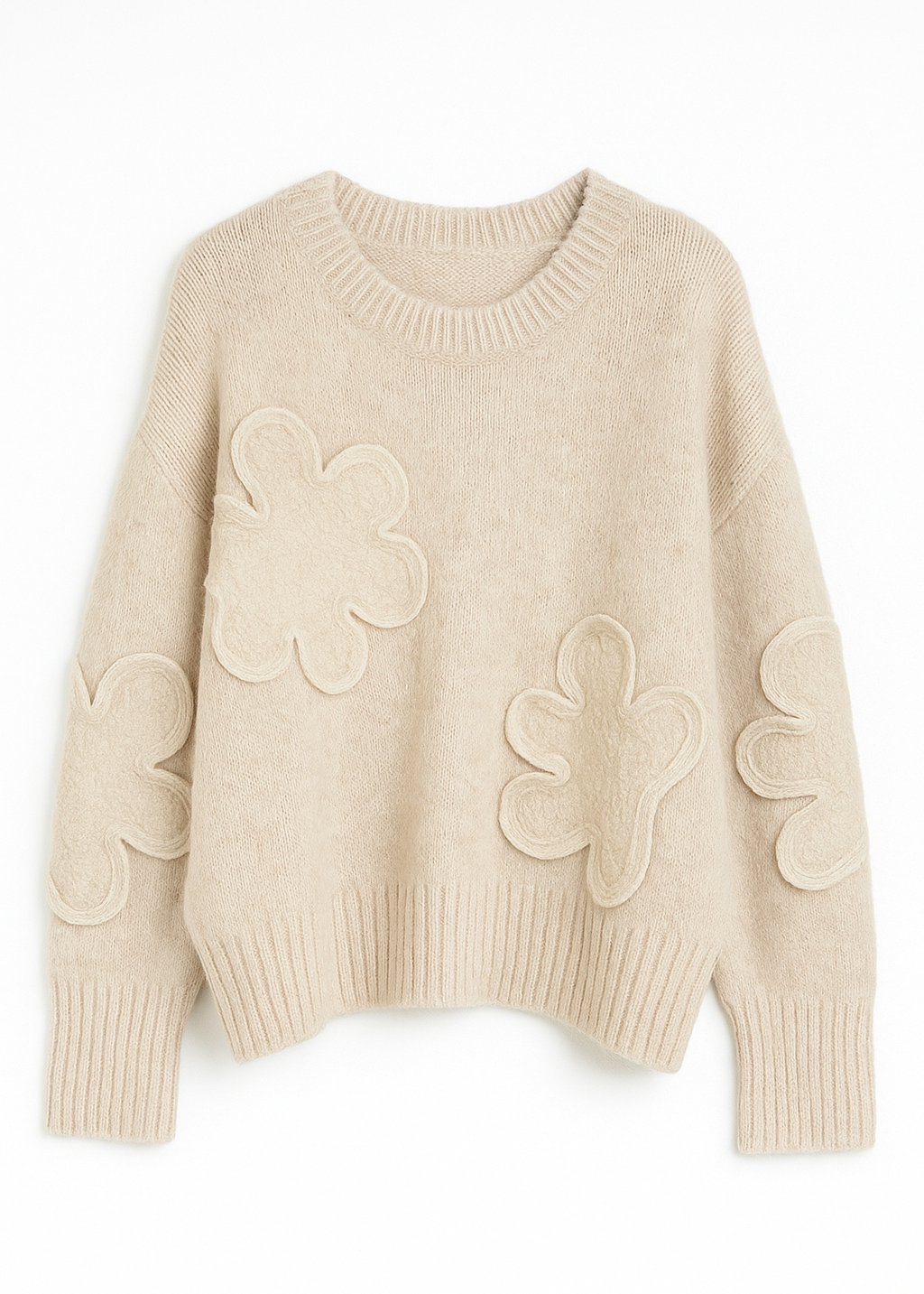 Beige sweater with floral patterns on a white background