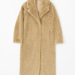 Beige fur coat on a white background