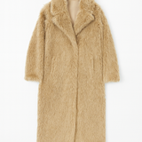 Beige fur coat on a white background