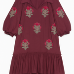 Maroon dress with floral embroidery on a white background