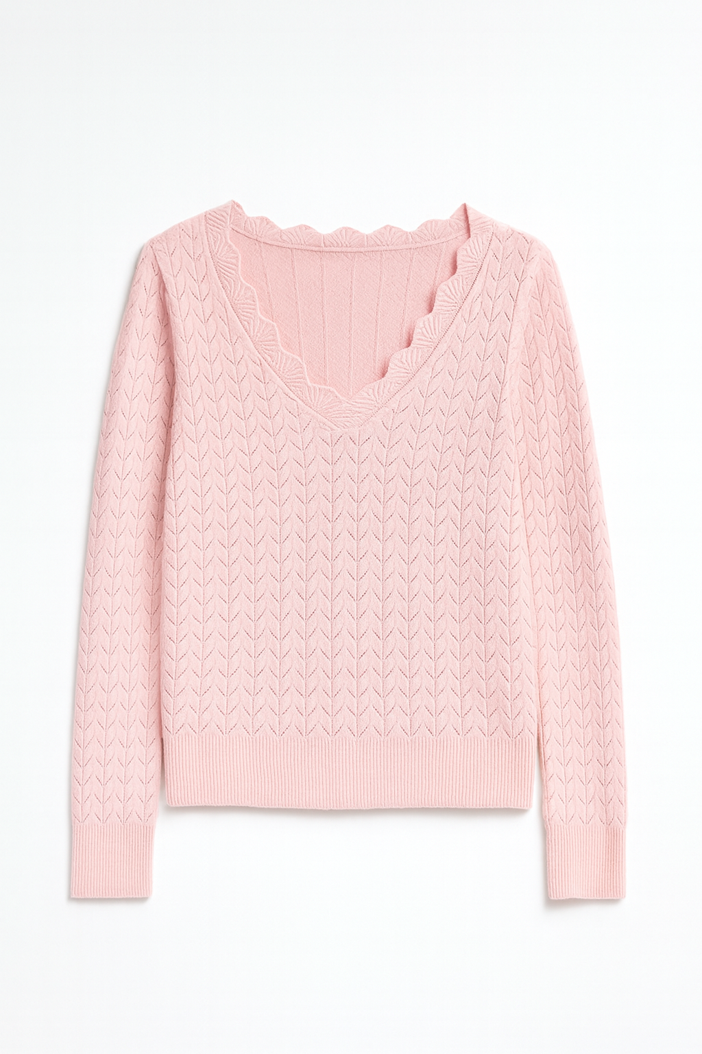 Pink cable knit sweater on a white background