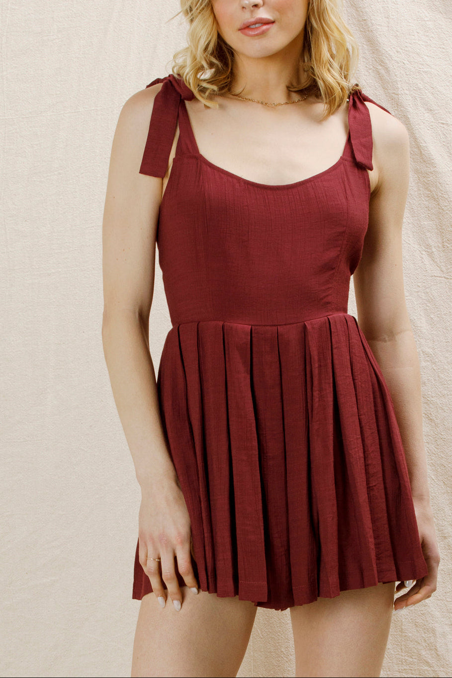 Lovey Dovey Pleated Romper in Wine - front