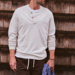 Marine Layer Luxe Jersey Henley in Oatmeal Heather layered under an overshirt