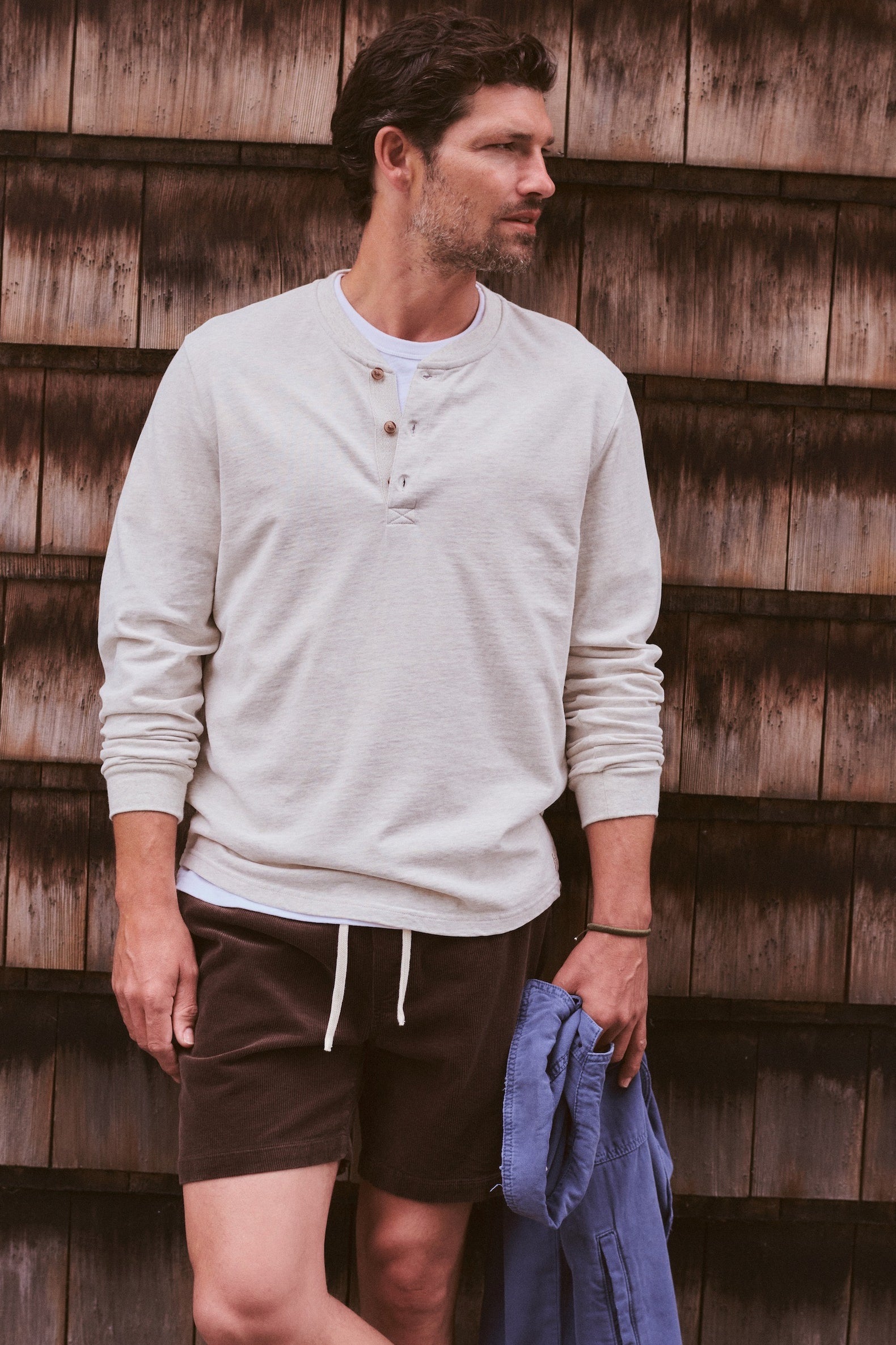 Marine Layer Luxe Jersey Henley in Oatmeal Heather layered under an overshirt