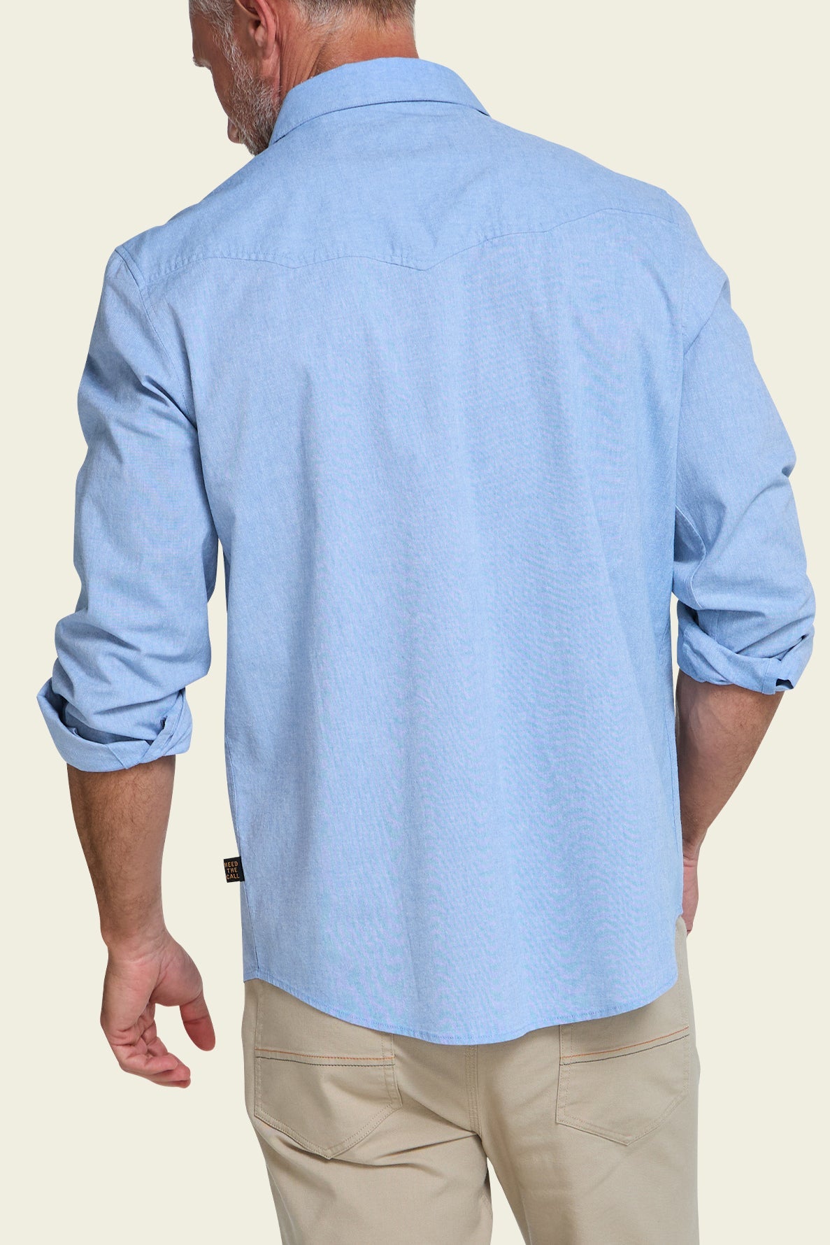 Howler Bros Crosscut Deluxe Snapshirt Fanned Flora on model, back