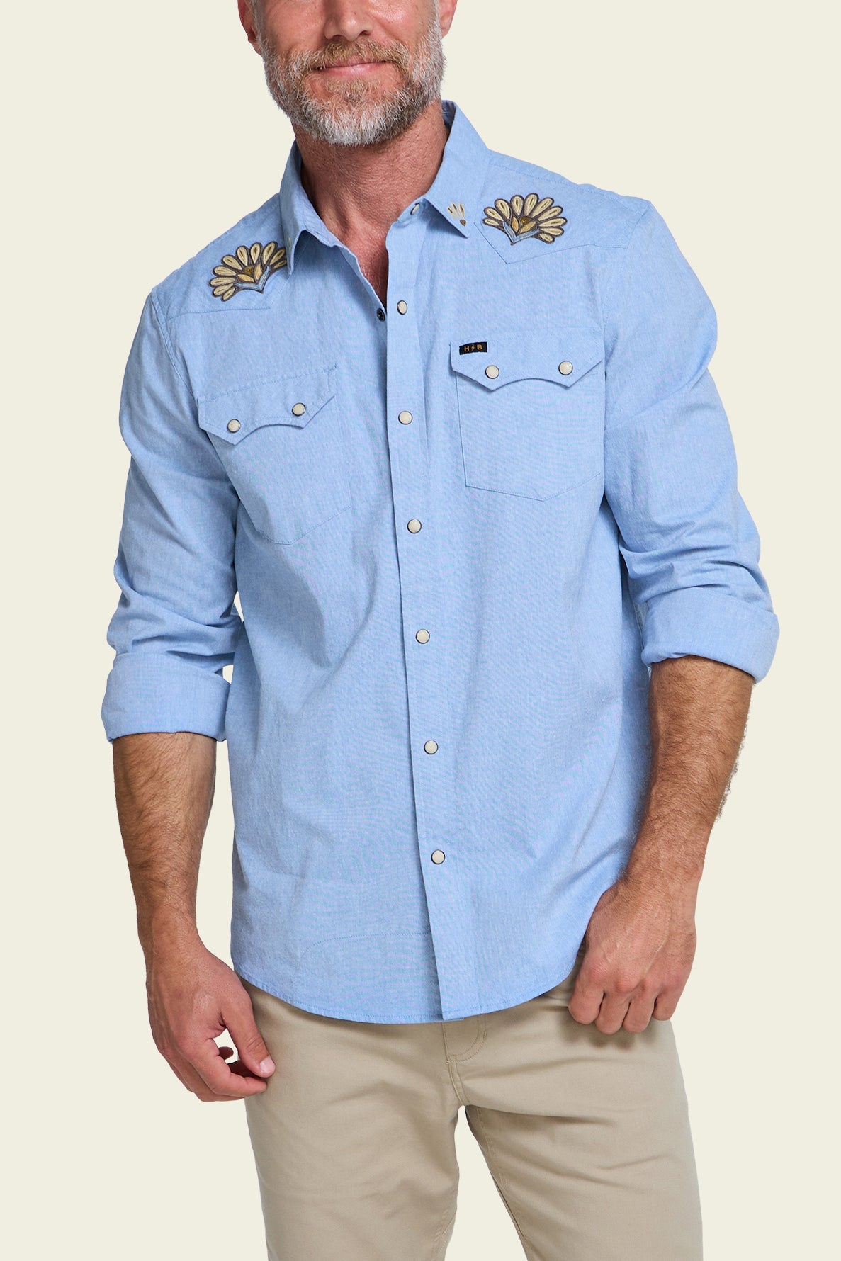 Howler Bros Crosscut Deluxe Snapshirt Fanned Flora on model, front