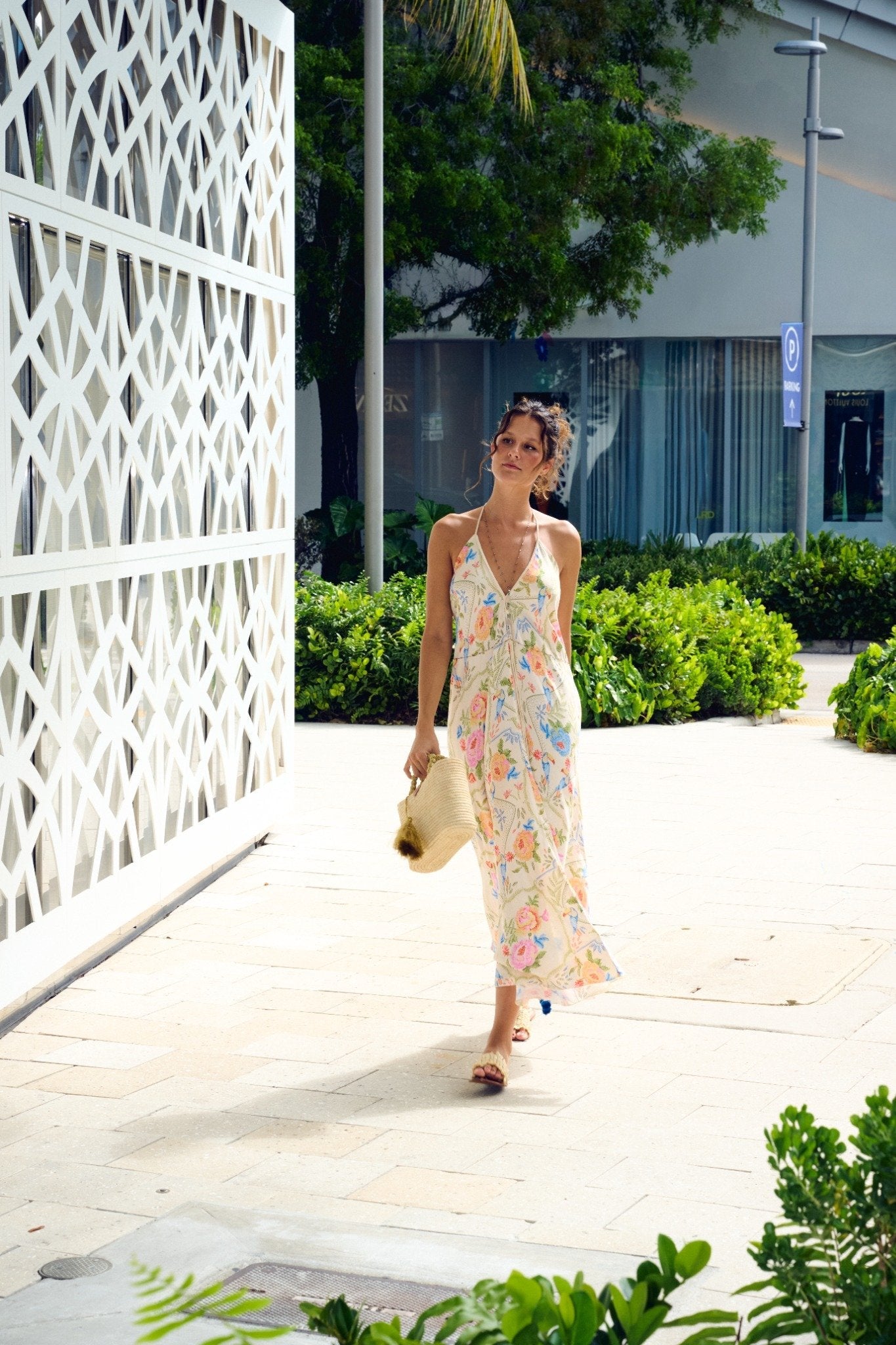 Z&L Europe Floricana Maxi Dress in multi color floral viscose worn outdoors, walking away