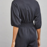 Sloane Zip Front Smocked Romper in Black - back view