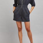 Sloane Zip Front Smocked Romper in Black - full length styled with heels