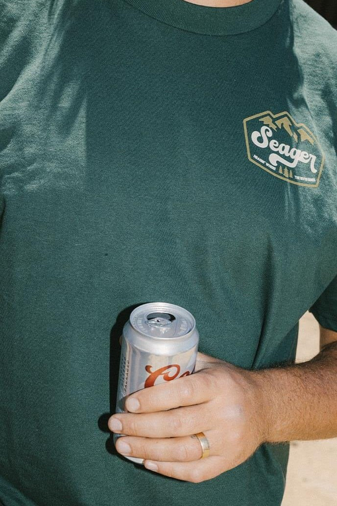 Man wearing the Seager High Country Tee in Forest Green, front view