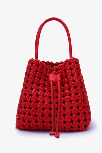 Red woven handbag with drawstring on a white background