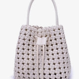 Woven handbag with drawstring on a white background