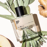 Guy Fox JP cologne bottle flat lay with fresh ginger and sage