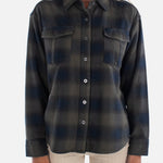 Woman wearing a plaid shirt on a white background