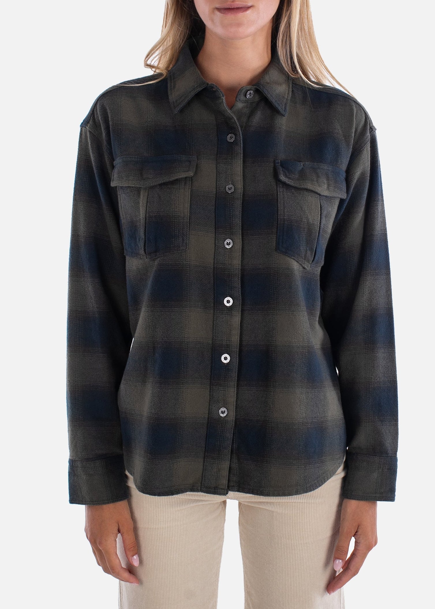 Woman wearing a plaid shirt on a white background