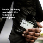 Person holding Guy Fox Marra unisex cologne bottle