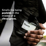 Person holding Guy Fox Marra unisex cologne bottle