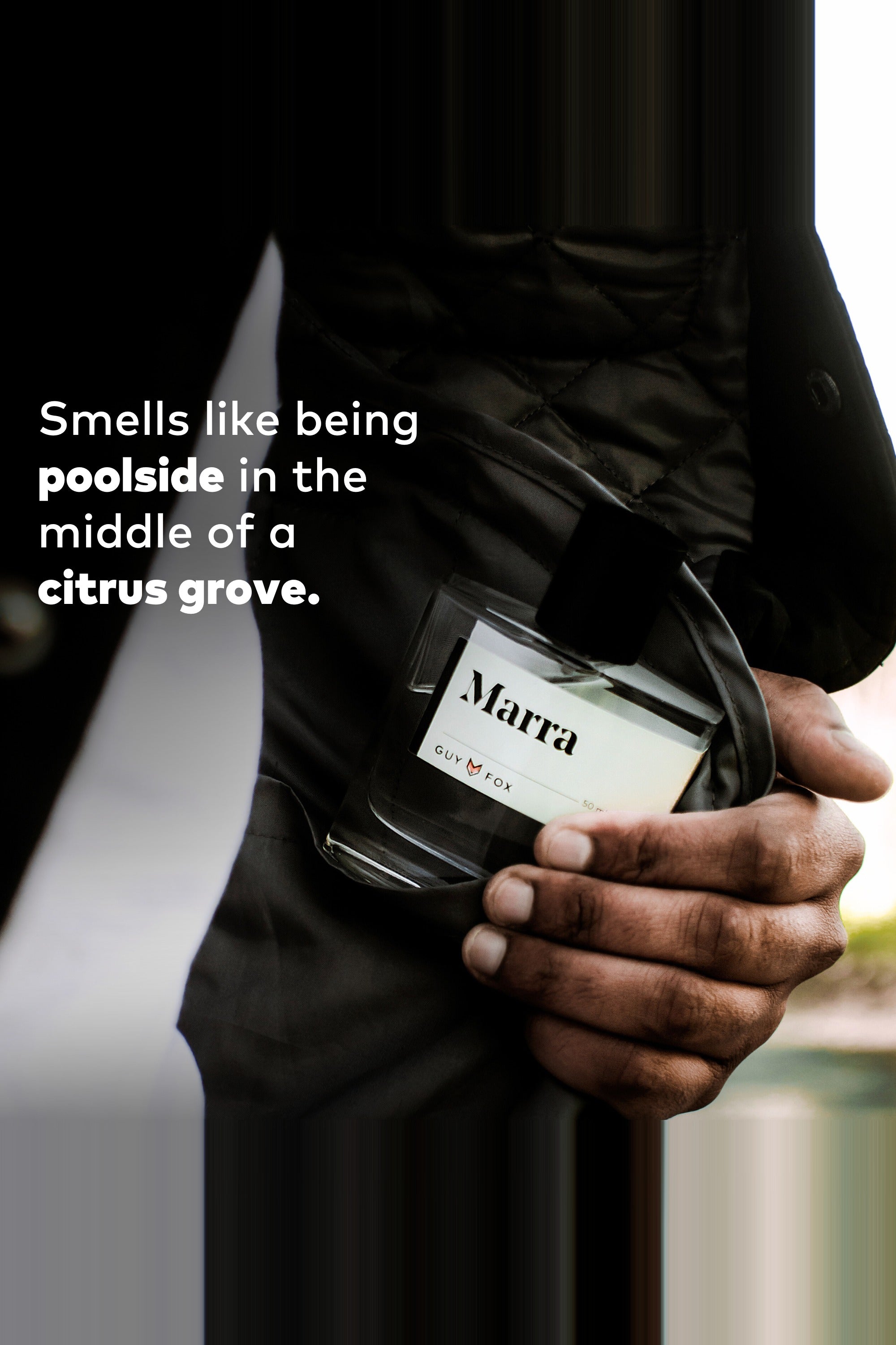Person holding Guy Fox Marra unisex cologne bottle