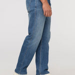 DUER Performance Denim+ Relaxed Straight in Dust Storm Indigo – side view