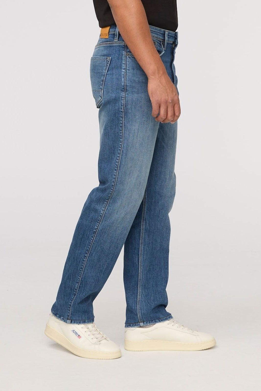 DUER Performance Denim+ Relaxed Straight in Dust Storm Indigo – side view