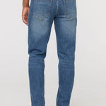 DUER Performance Denim+ Relaxed Straight in Dust Storm Indigo – back view