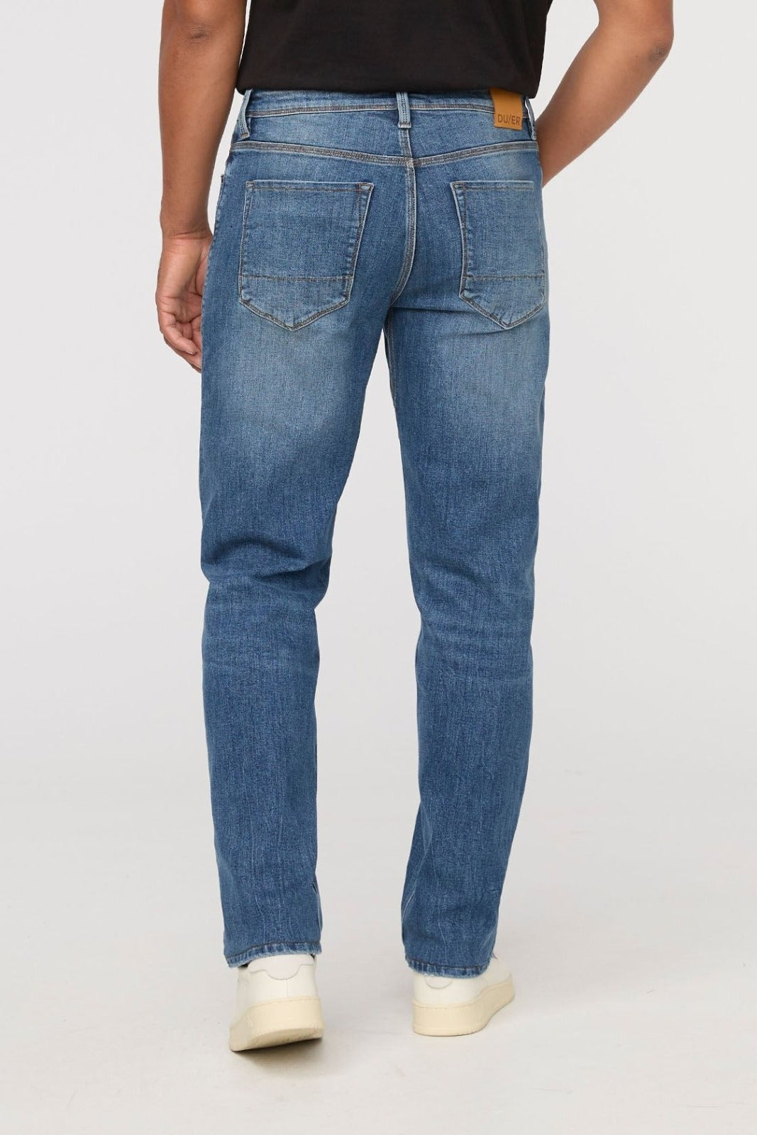 DUER Performance Denim+ Relaxed Straight in Dust Storm Indigo – back view