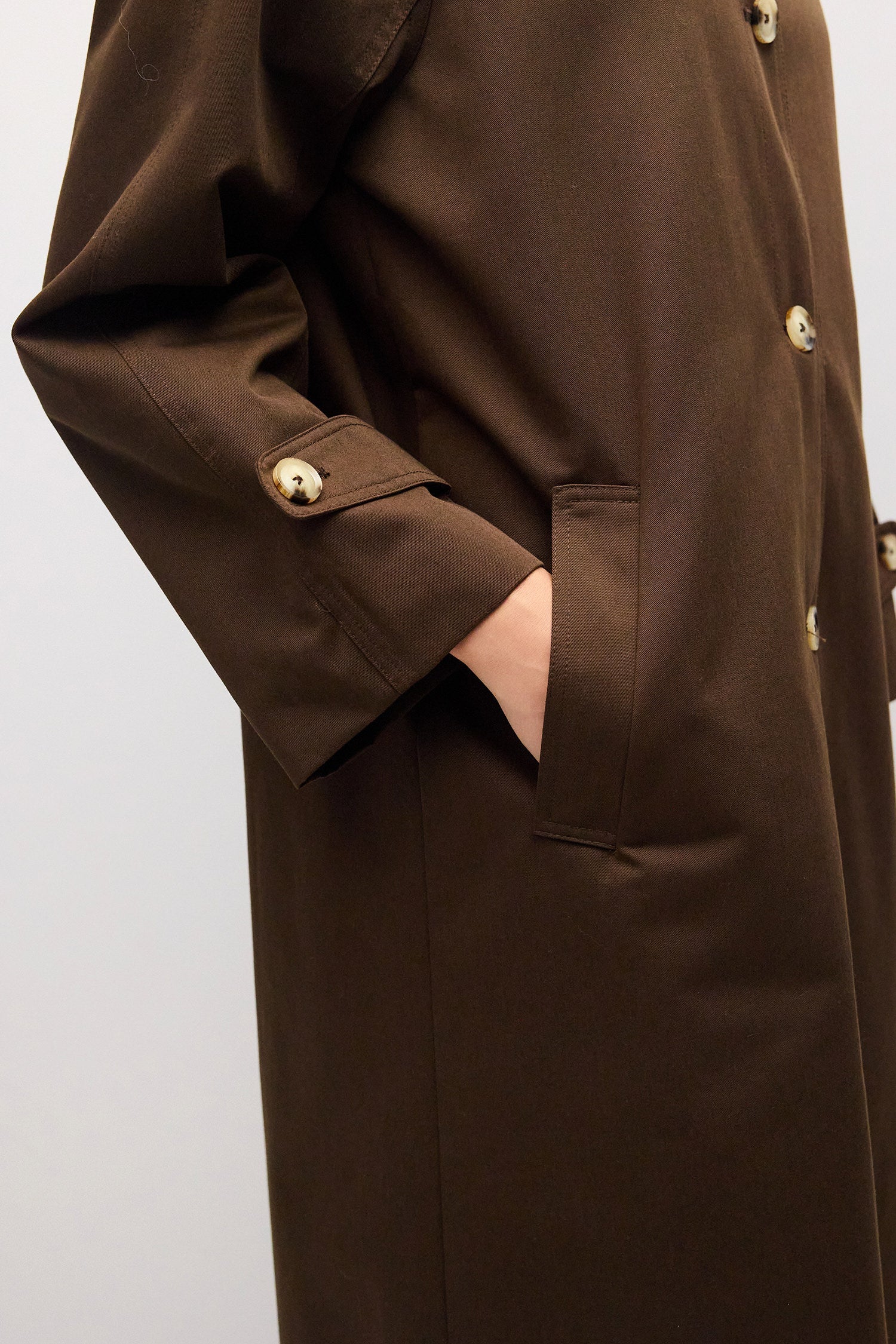 Close up of welt pocket and adjustable cuff detail