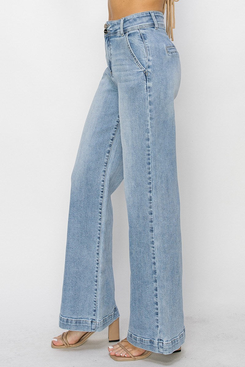 Light blue jeans worn by a person on a white background