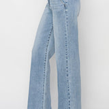 Light blue jeans worn by a person on a white background