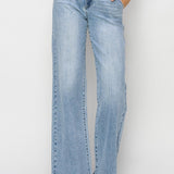 Light blue jeans worn by a person on a white background