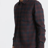 Man wearing a plaid shirt on a white background