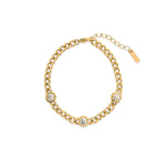 Gold curb chain bracelet with three bezel-set cubic zirconia