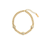 Gold curb chain bracelet with three bezel-set cubic zirconia