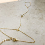 Dainty cubic zirconia hand chain worn on the hand