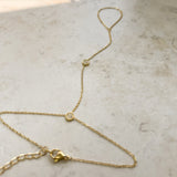 Dainty cubic zirconia hand chain worn on the hand
