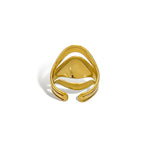 Triple layer sculptural ring gold detail