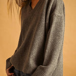 Mocha V-neck knit sweater, side view showing ribbed cuff